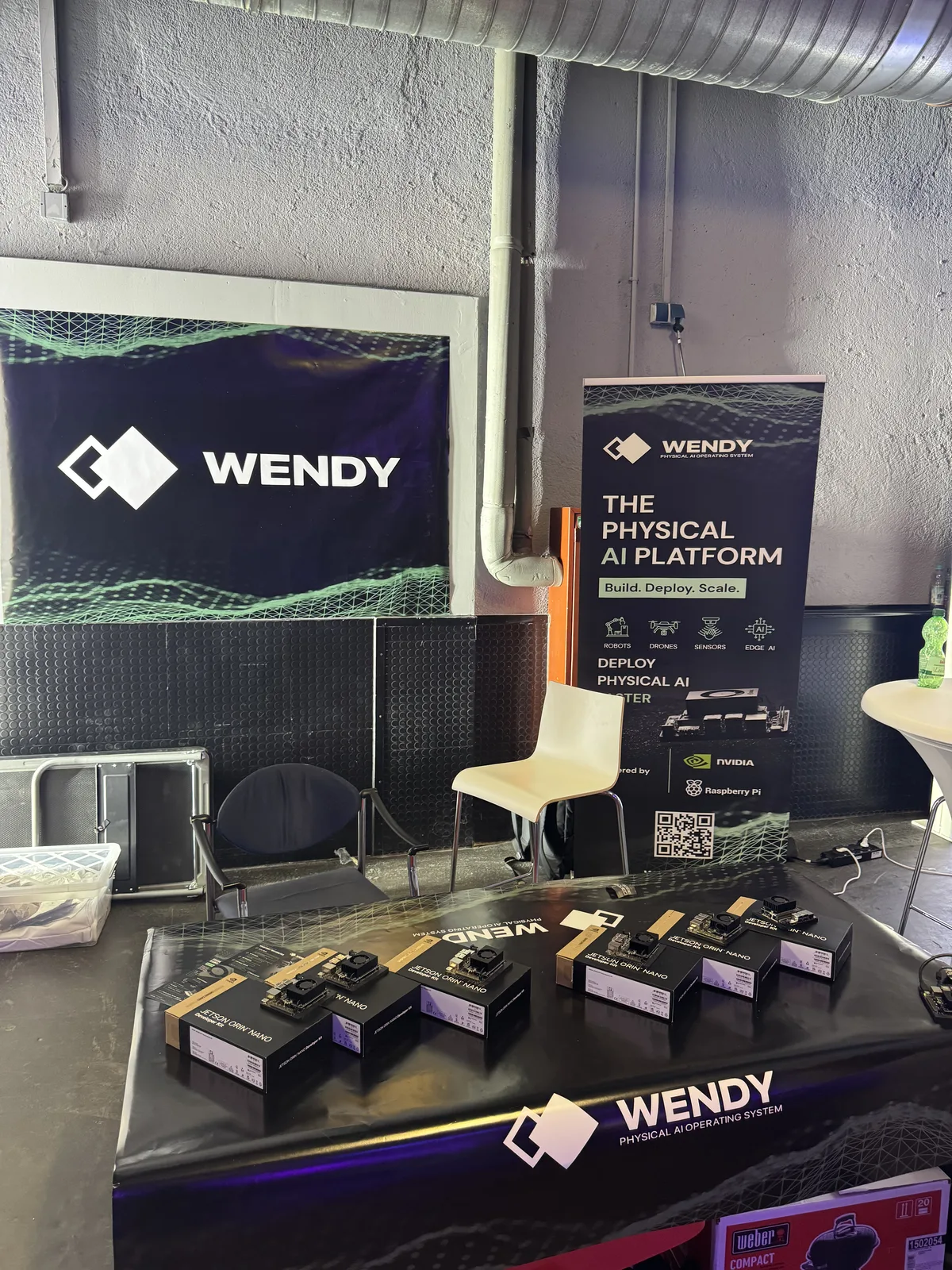 Wendy booth with a table of NVIDIA Jetson Orin Nano kits ready for hackathon teams