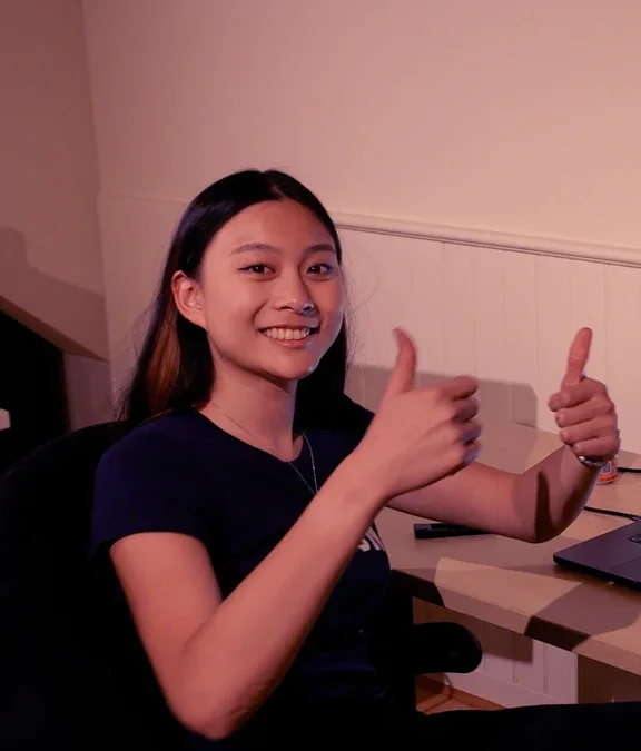 Claire Wang at her desk after the first WendyOS deploy