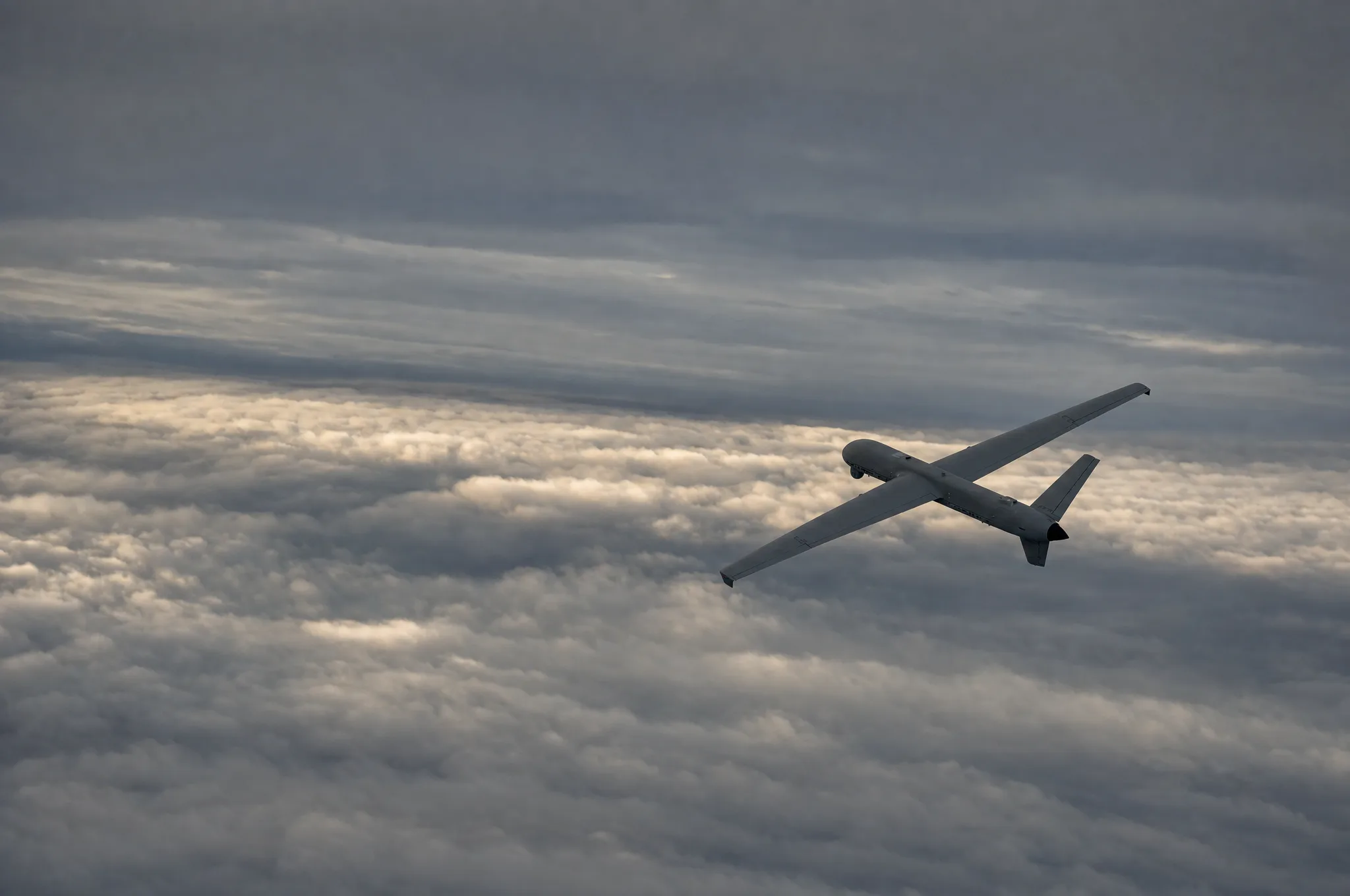 Fixed-wing unmanned aircraft above a sea of clouds