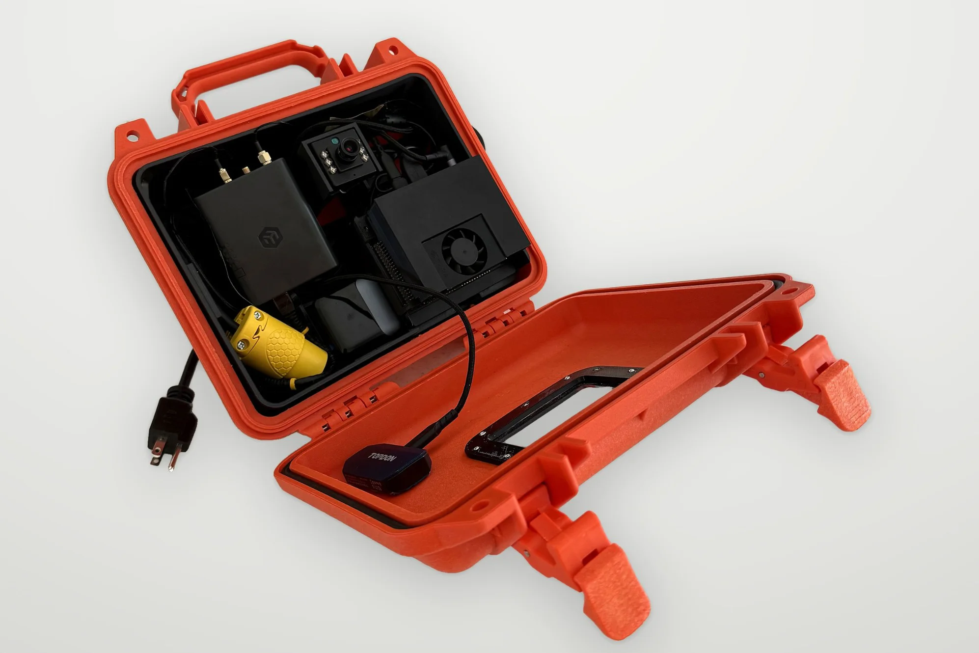 Open orange Wendy Box with the cameras, compute module, and LTE hub inside