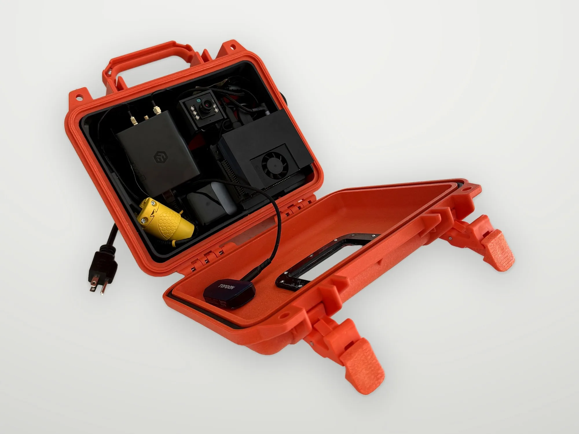 Open orange Wendy Box portable kit with cameras and compute inside